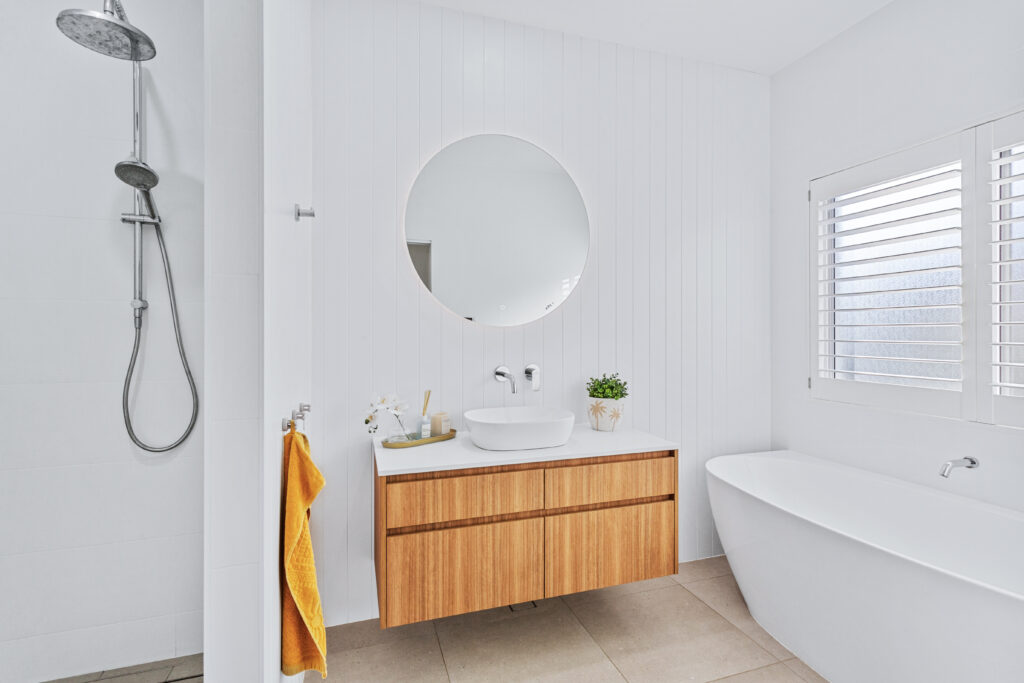 Stylish bathroom at 10AirStayz featuring premium fixtures and a walk-in shower